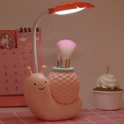 Rechargeable Colorful Dinosaur Snail Lamp with Pen Stand for Kids' Desks.